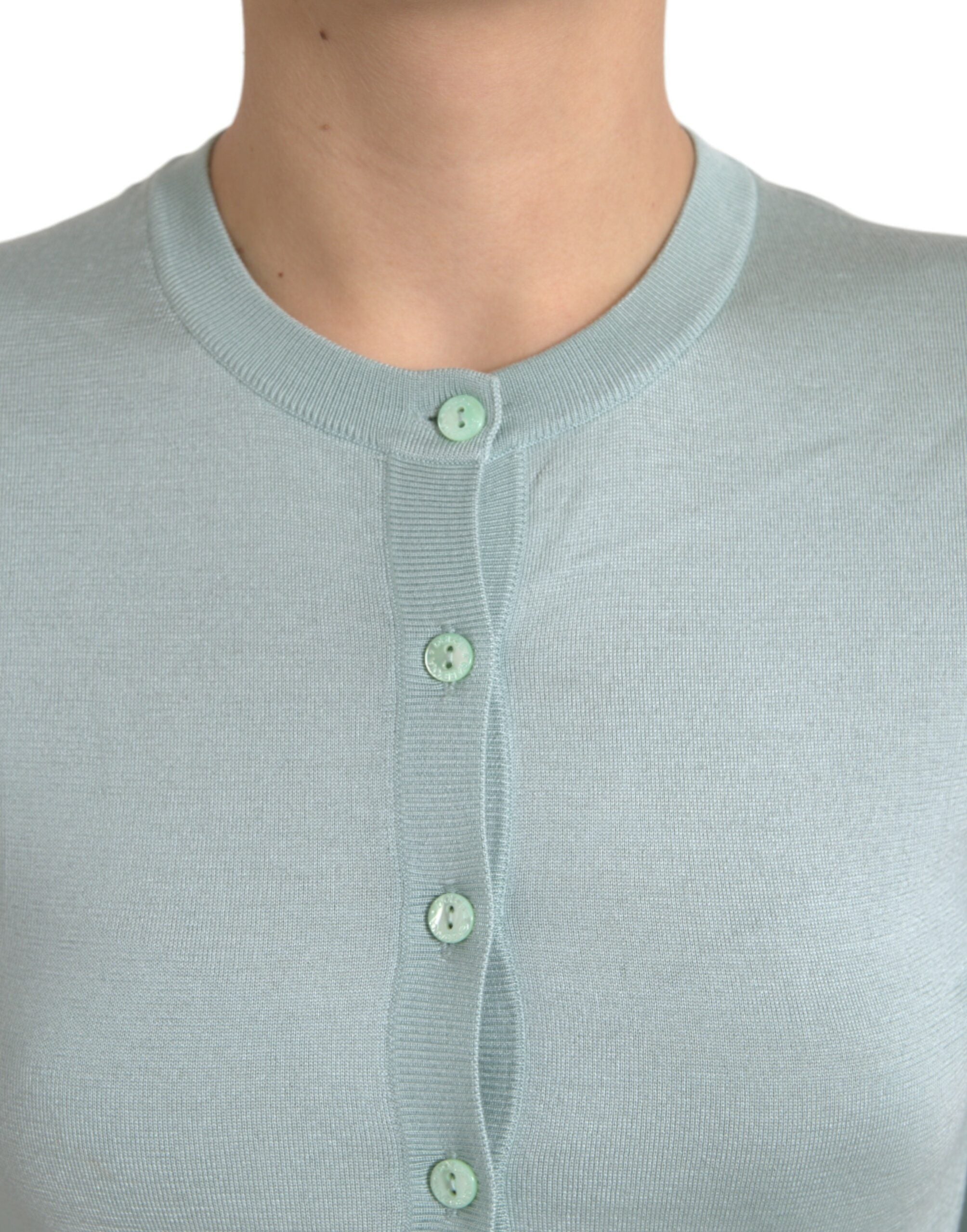 Light blue silk crew neck cardigan sweater by Dolce & Gabbana, showing the soft, smooth fabric and classic fit.