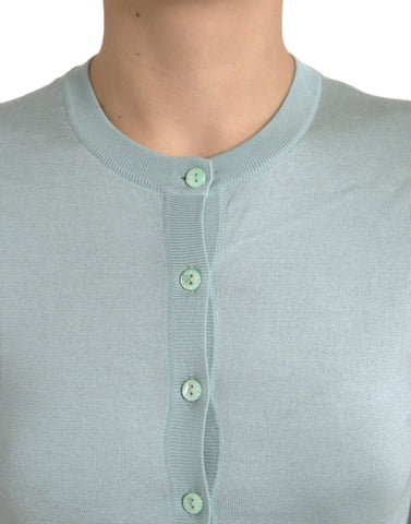 Light blue silk crew neck cardigan sweater by Dolce & Gabbana, showing the soft, smooth fabric and classic fit.