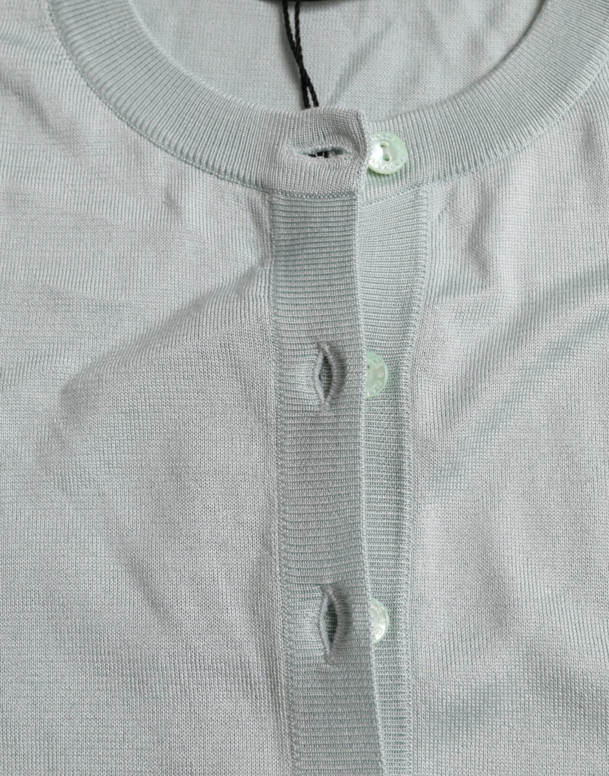 Light blue silk crew neck cardigan sweater by Dolce & Gabbana, featuring a soft, luxurious fabric and classic design.
