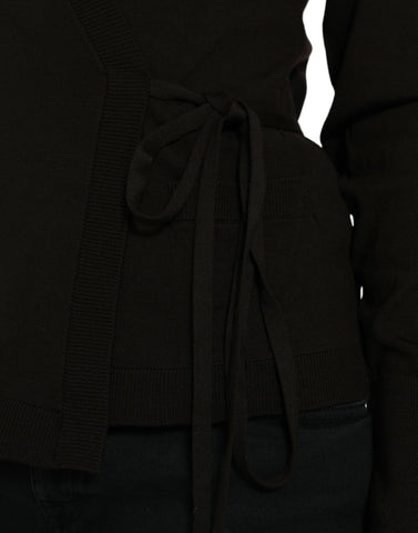 Black wool V-neck crossed cardigan sweater by Dolce & Gabbana with long sleeves and button closure, displayed on a neutral background.