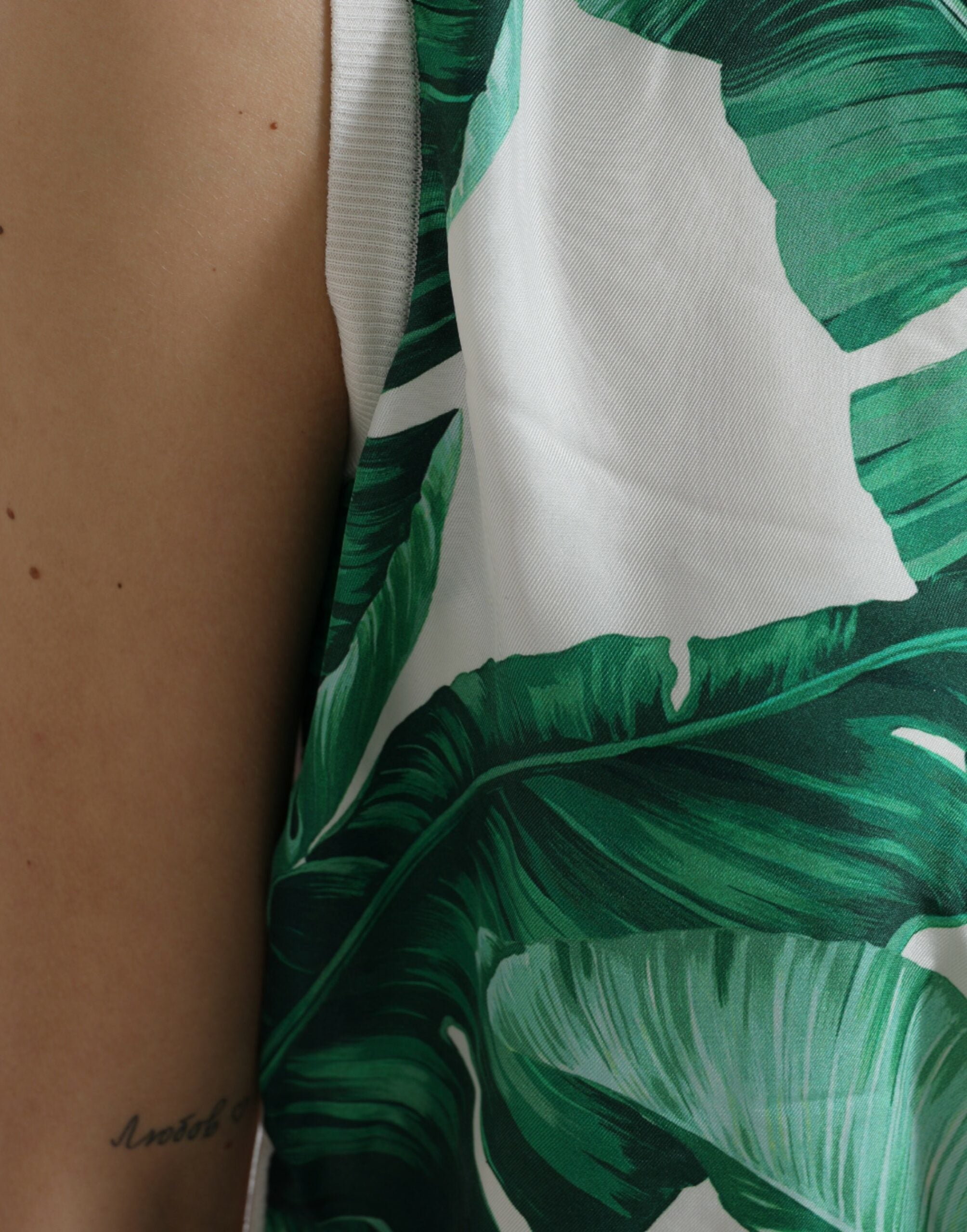 White crew neck tank top with banana leaf print by Dolce & Gabbana, showcasing a stylish, tropical-themed sleeveless design.