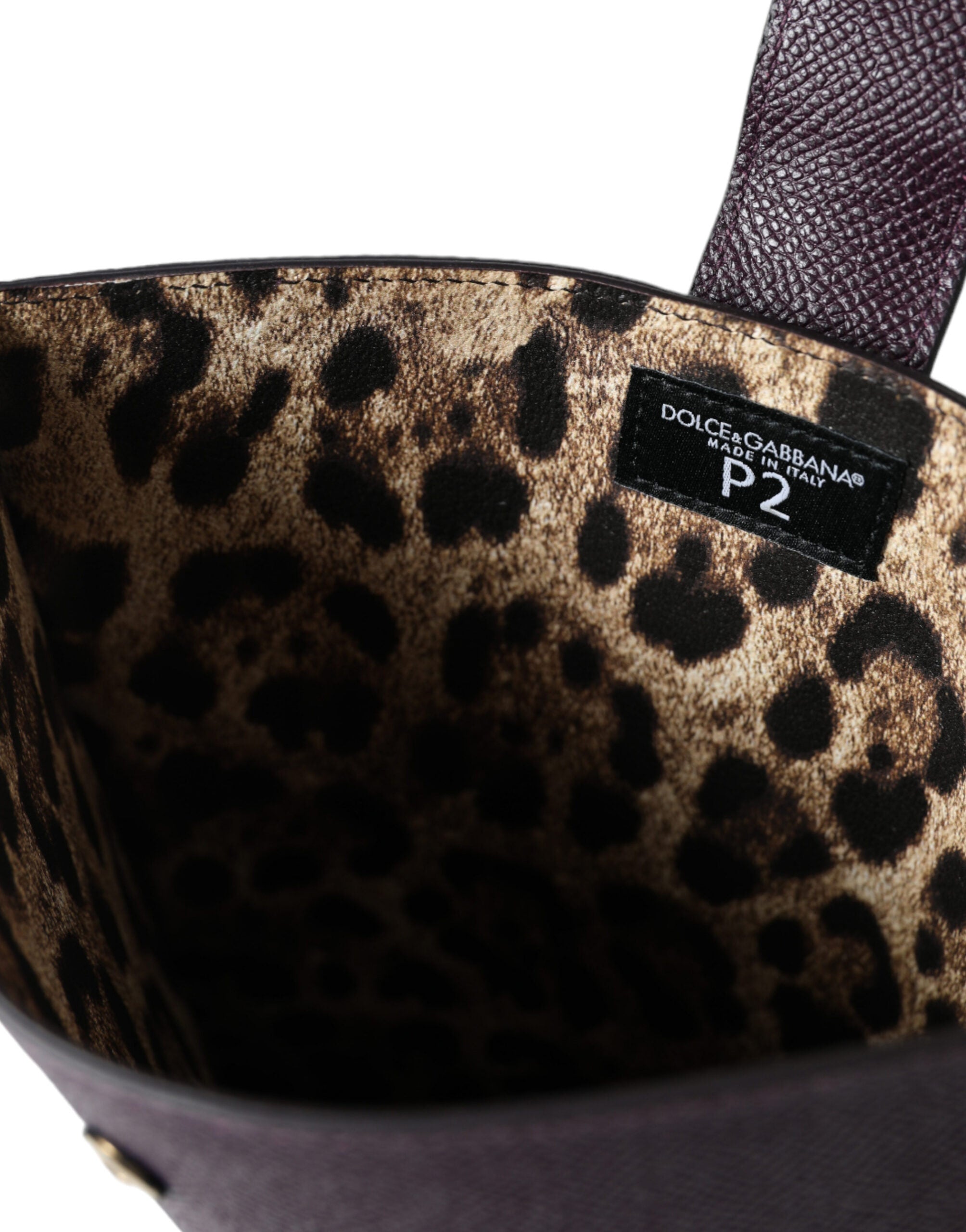 Dark brown leather tablet case with Dolce & Gabbana logo plaque cover, sleek protective sleeve for stylish device protection.