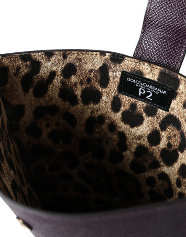 Dark brown leather tablet case with Dolce & Gabbana logo plaque cover, sleek protective sleeve for stylish device protection.