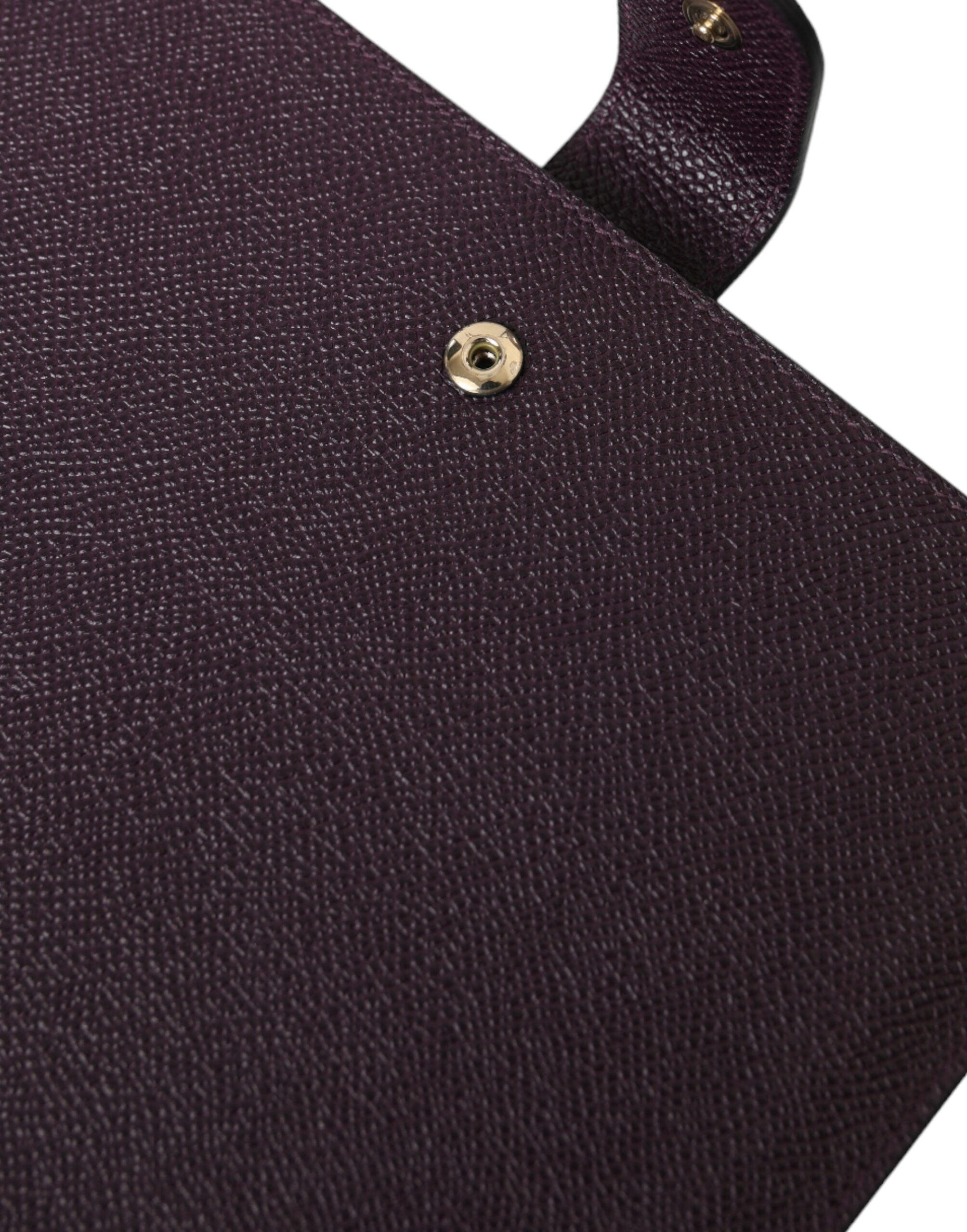 Dark brown leather tablet case with Dolce & Gabbana logo plaque cover, featuring sleek design and protective cover for tablets.