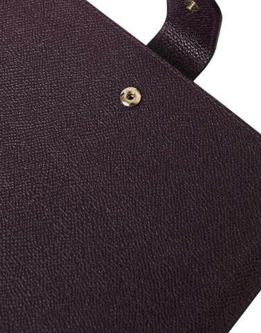 Dark brown leather tablet case with Dolce & Gabbana logo plaque cover, featuring sleek design and protective cover for tablets.