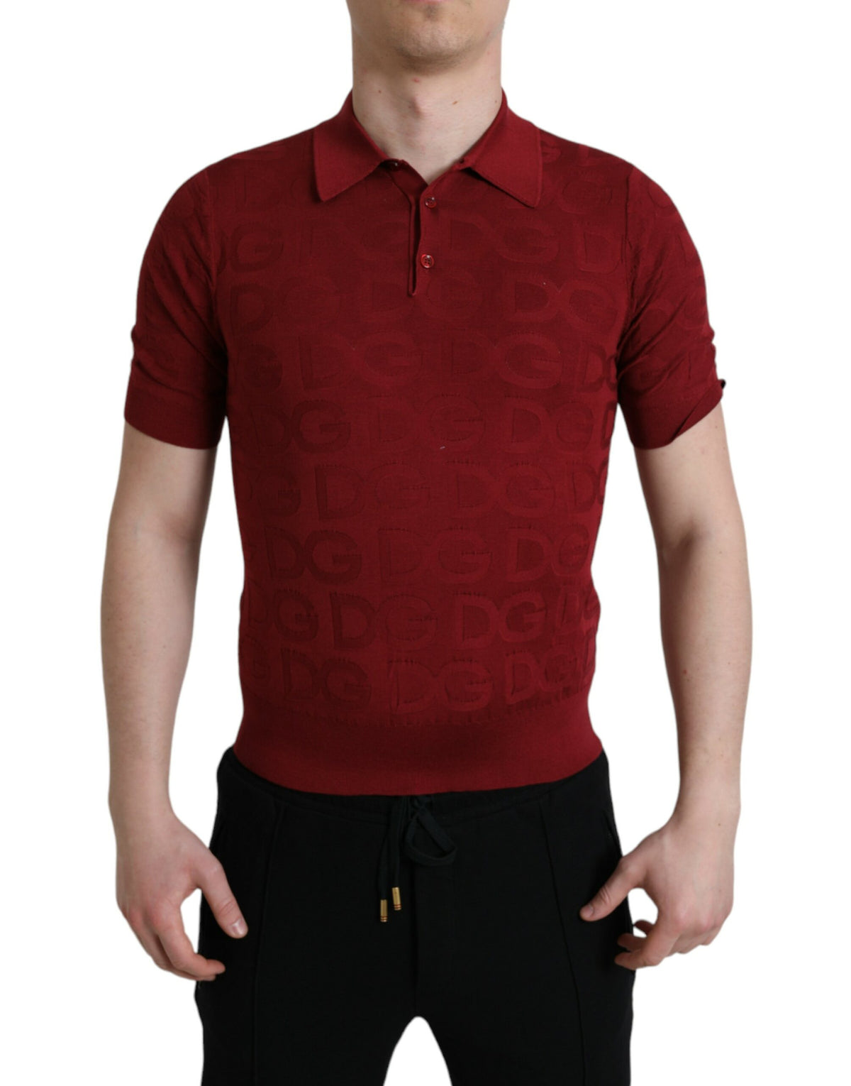 Maroon Dolce & Gabbana silk short sleeve T-shirt with a collared neckline, shown on a hanger.