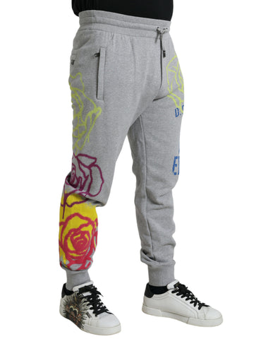 Gray cotton graffiti jogger pants by Dolce & Gabbana, featuring a relaxed fit and graffiti print design.