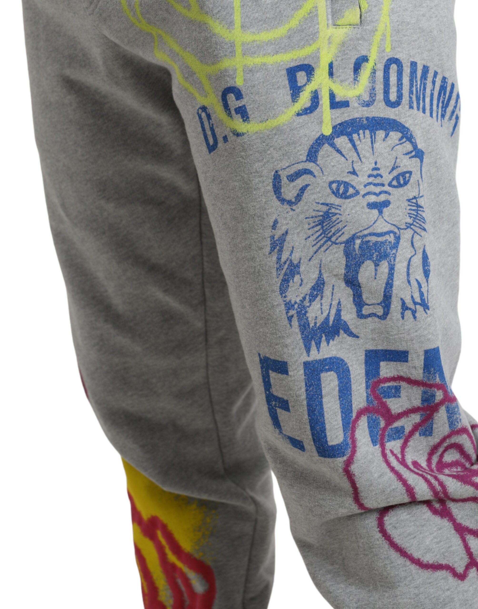 Gray cotton graffiti jogger pants by Dolce & Gabbana, featuring relaxed fit and stylish graffiti print on soft fabric.