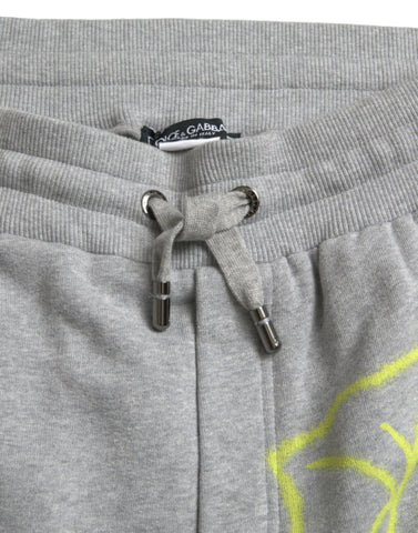 Gray cotton graffiti sweatpants by Dolce & Gabbana, featuring relaxed jogger style with artistic graffiti print.