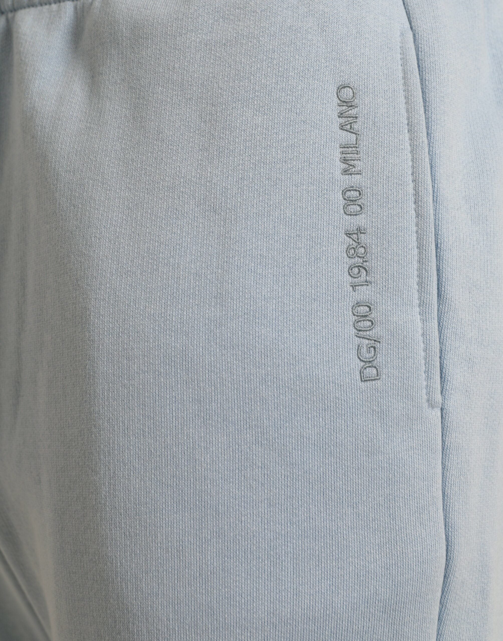 Light blue cotton jogger pants for men by Dolce & Gabbana, featuring a relaxed fit and casual style.