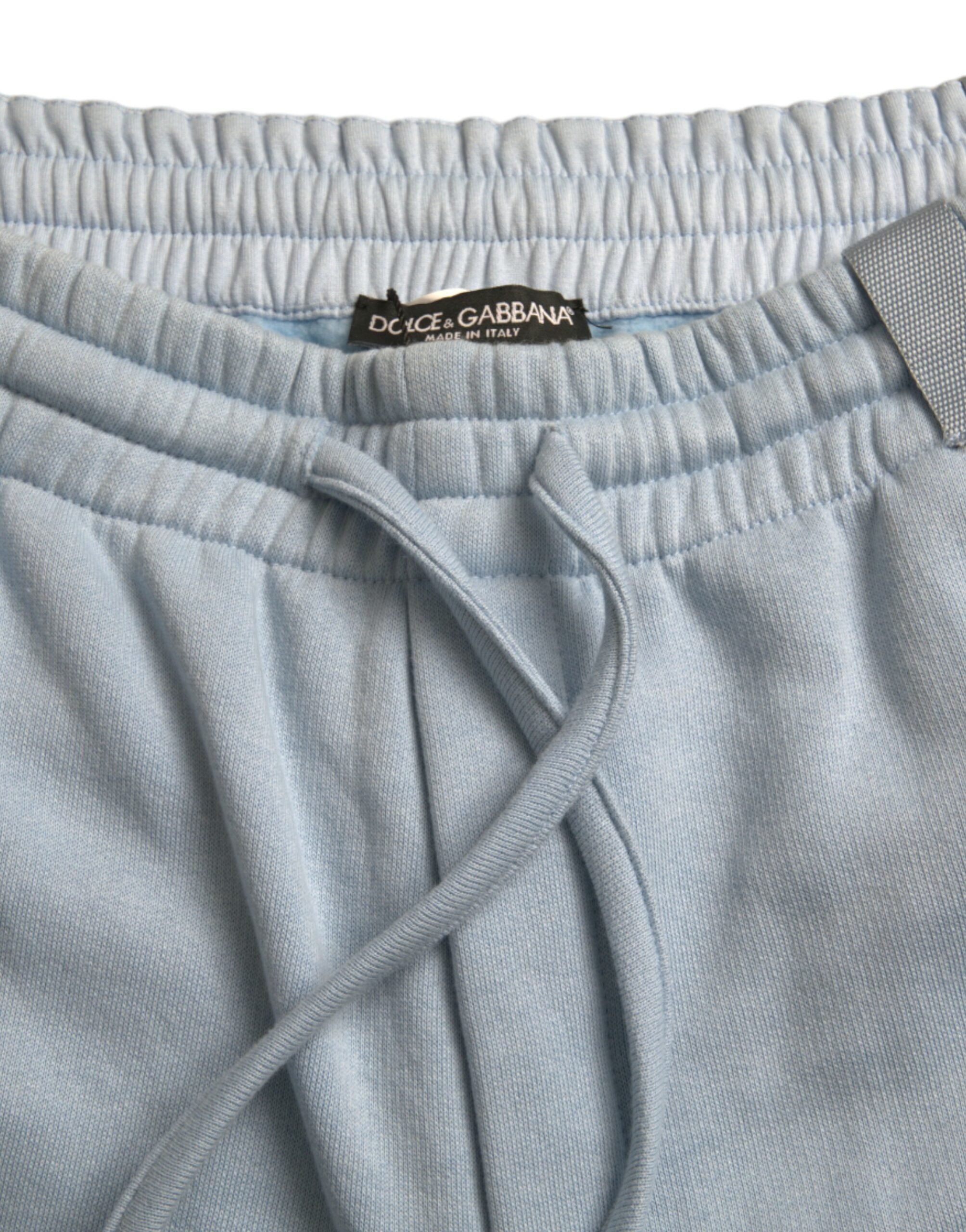 Light blue cotton sweatpants for men by Dolce & Gabbana, featuring jogger style with elastic waistband and relaxed fit.