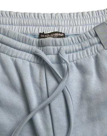 Light blue cotton sweatpants for men by Dolce & Gabbana, featuring jogger style with elastic waistband and relaxed fit.