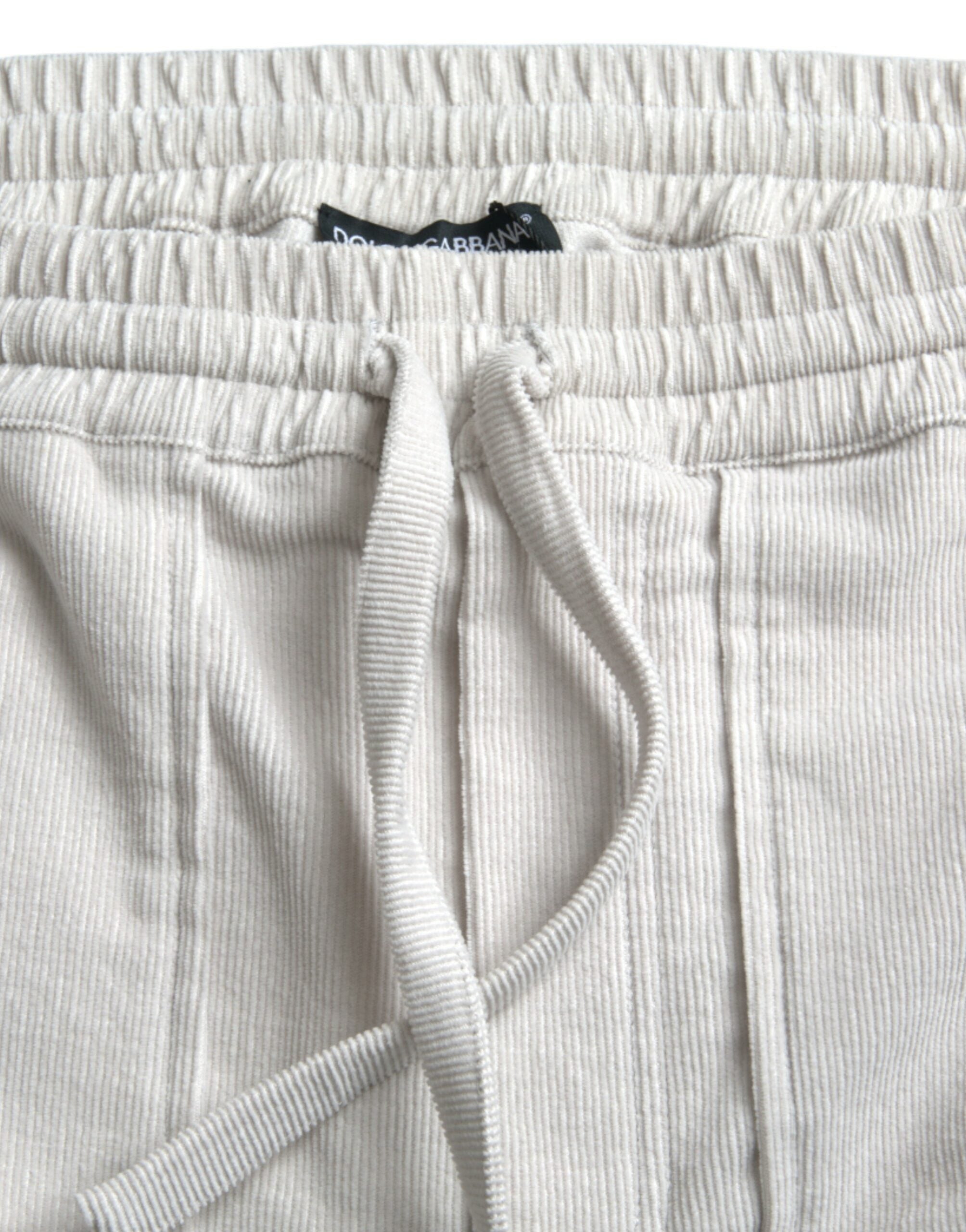 Beige cotton corduroy logo Bermuda shorts by Dolce & Gabbana with a relaxed fit and classic design.