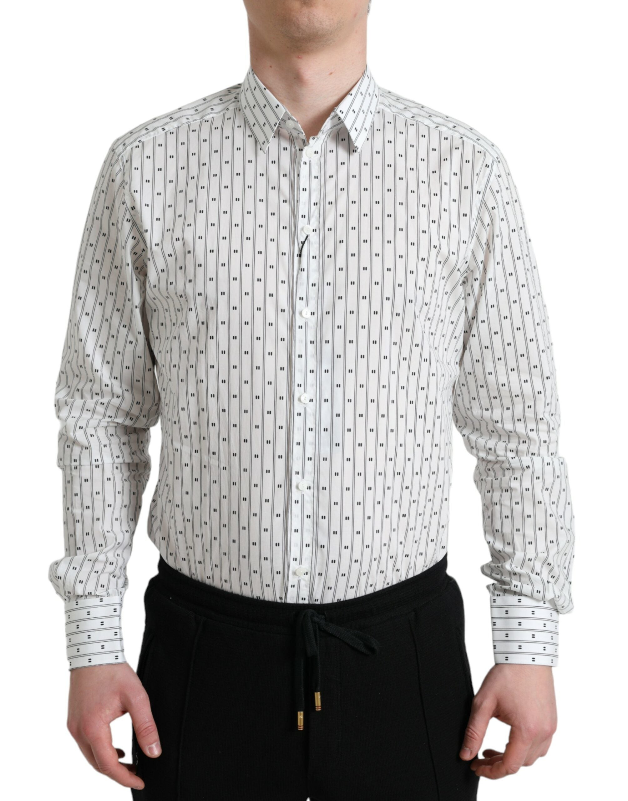 White patterned men's formal dress shirt by Dolce & Gabbana, featuring a gold design and classic collar, suitable for elegant occasions.