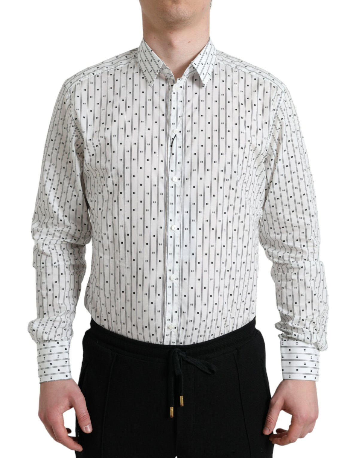 White patterned men's formal dress shirt by Dolce & Gabbana, featuring a gold design and classic collar, suitable for elegant occasions.