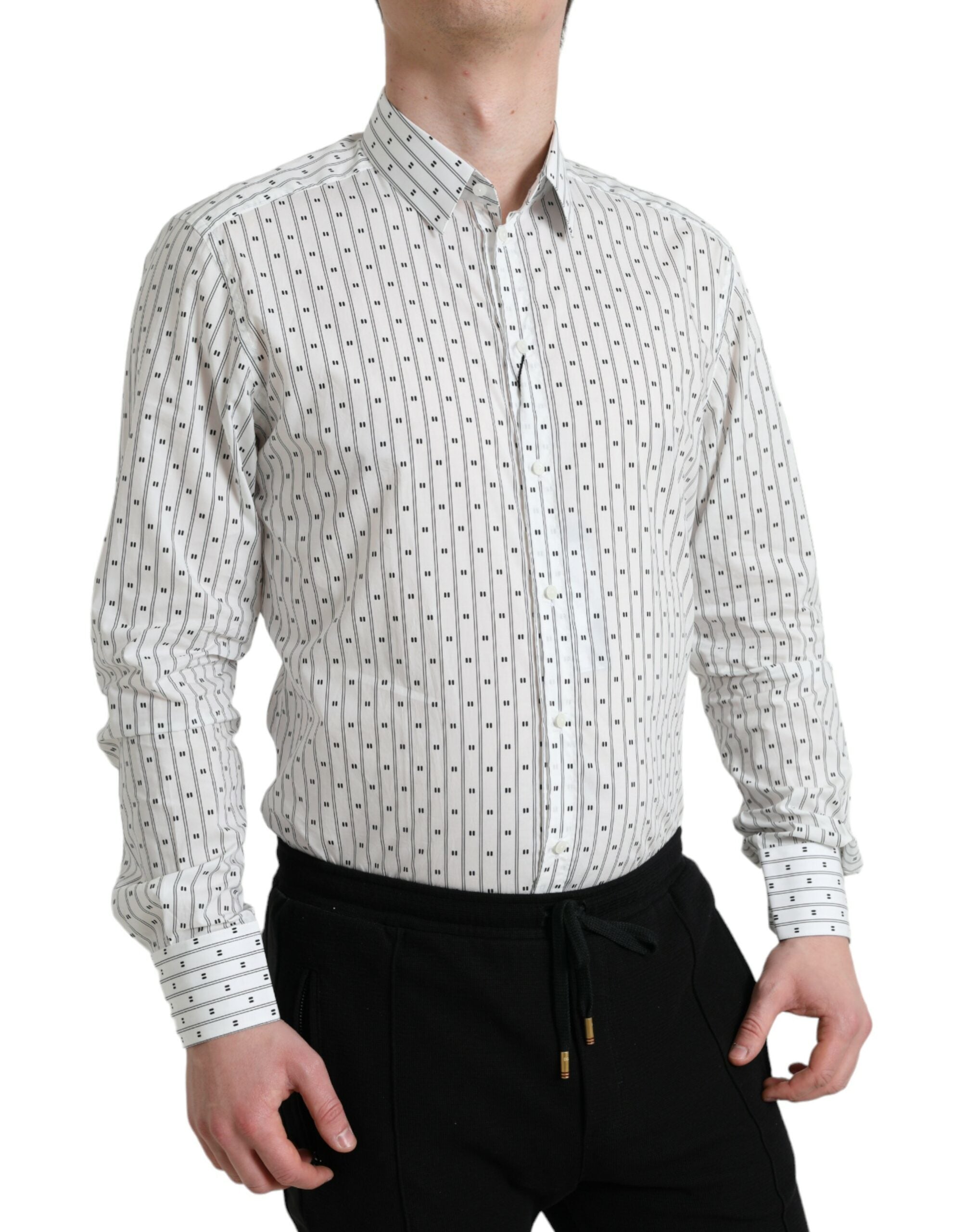 White patterned men's formal dress shirt by Dolce & Gabbana with gold accents, featuring a stylish, tailored fit.