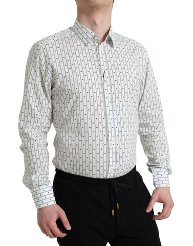 White patterned men's formal dress shirt by Dolce & Gabbana with gold accents, featuring a stylish, tailored fit.
