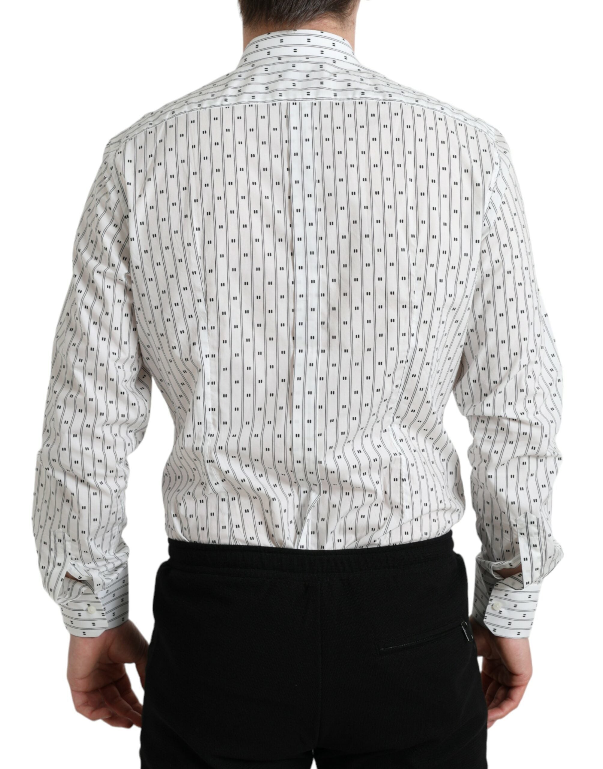 White patterned men's formal dress shirt by Dolce & Gabbana with gold accents, tailored fit, and stylish design.