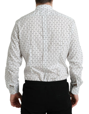 White patterned men's formal dress shirt by Dolce & Gabbana with gold accents, tailored fit, and stylish design.