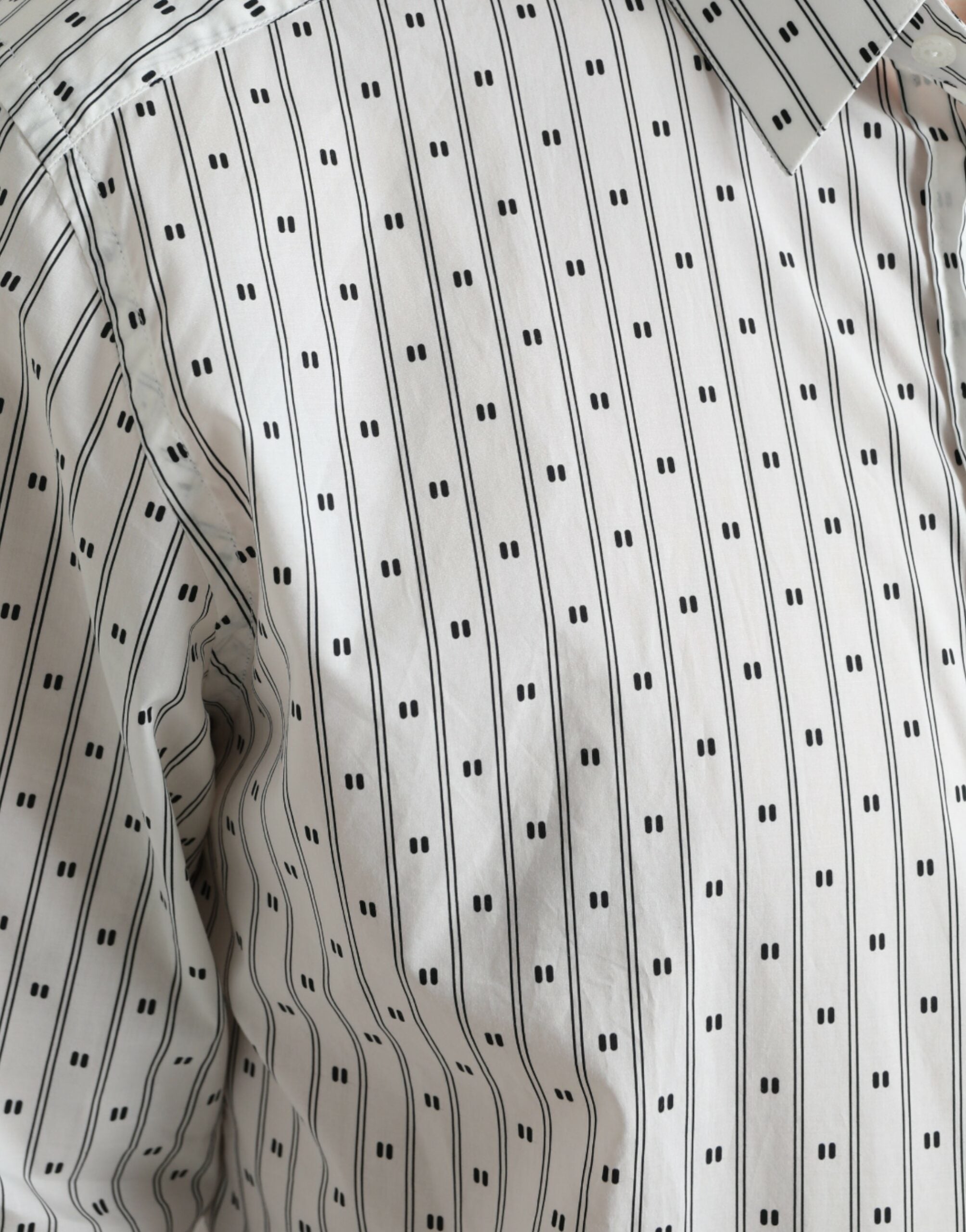 White patterned men's formal dress shirt by Dolce & Gabbana with gold accents and a tailored fit.