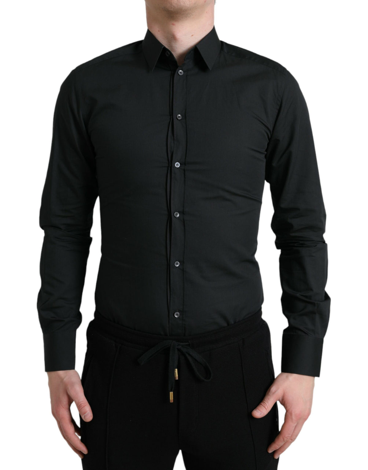 Black cotton silk formal dress shirt by Dolce & Gabbana, featuring a sleek gold accent, displayed on a mannequin.