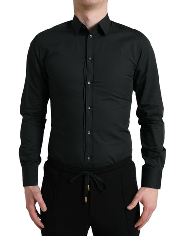 Black cotton silk formal dress shirt by Dolce & Gabbana, featuring a sleek gold accent, displayed on a mannequin.