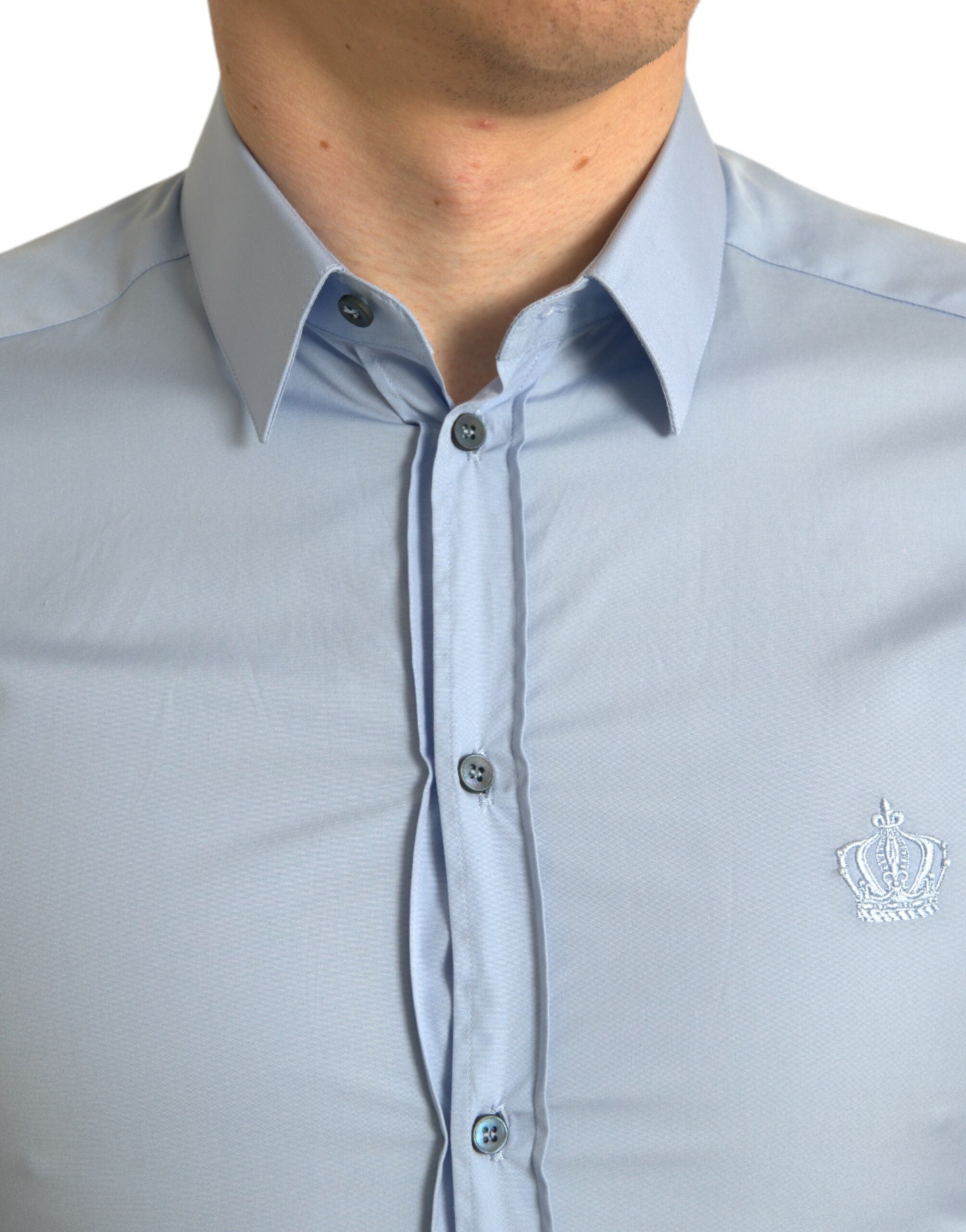 Sky blue cotton men's formal dress shirt by Dolce & Gabbana, featuring a classic fit and gold accents, displayed on a hanger.