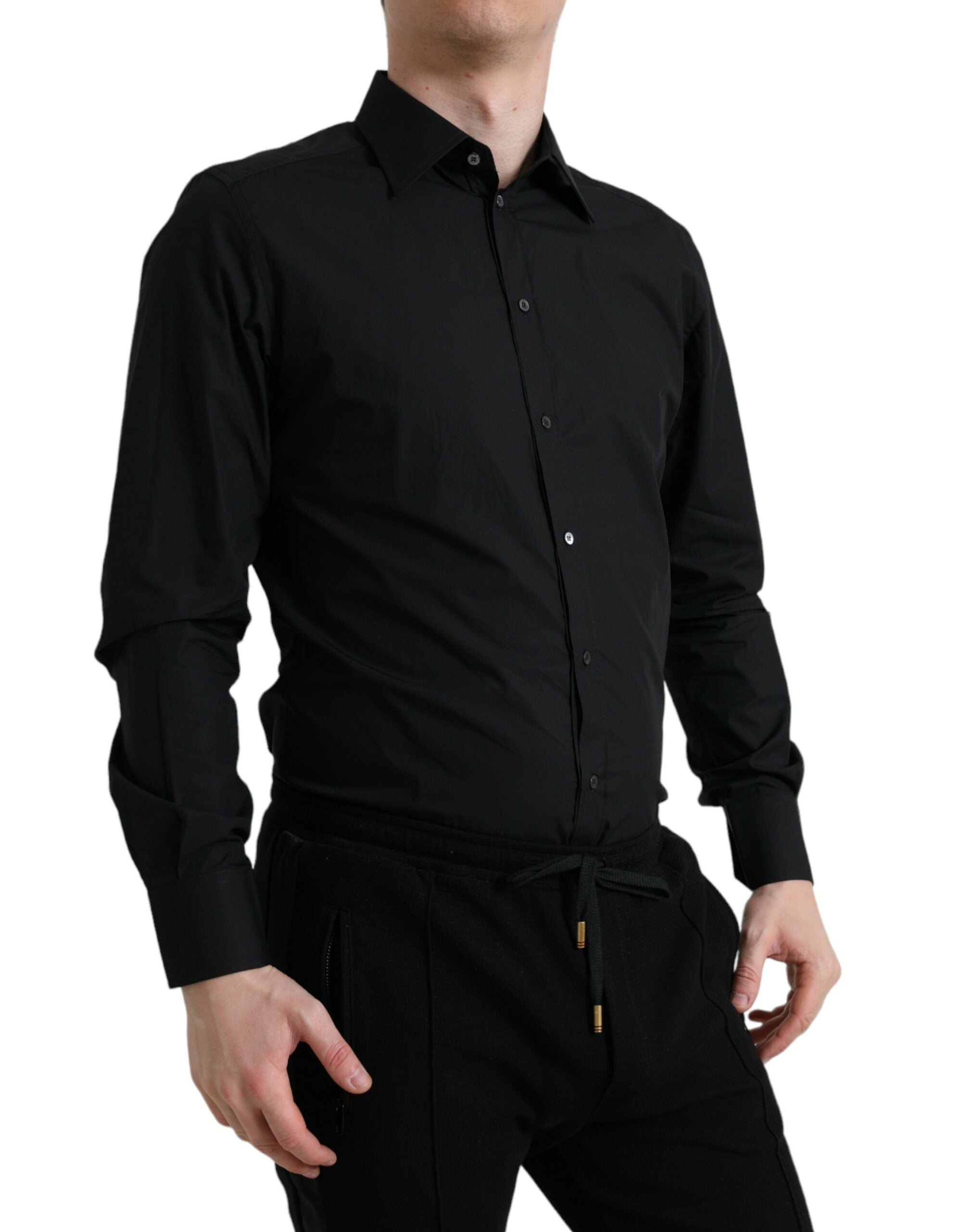 Black cotton men's formal gold dress shirt by Dolce & Gabbana, displayed flat with collar and button details.