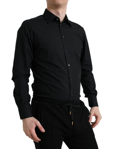 Black cotton men's formal gold dress shirt by Dolce & Gabbana, displayed flat with collar and button details.
