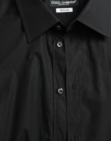 Black cotton men's formal dress shirt by Dolce & Gabbana, featuring gold accents and a classic fit.