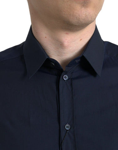 Navy blue slim fit formal gold dress shirt by Dolce & Gabbana, displayed on a hanger with detailed fabric texture.