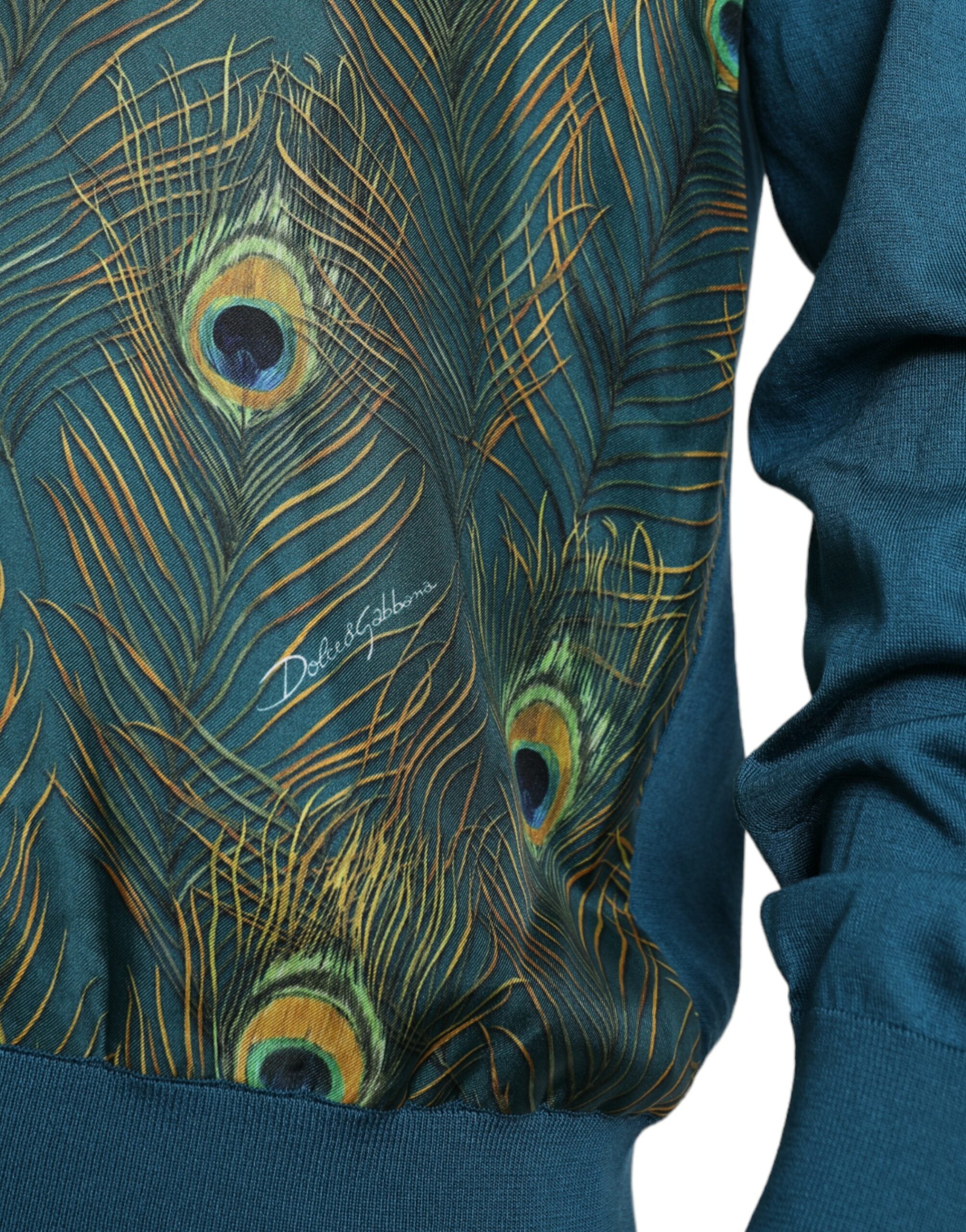 Green peacock feather pullover sweater by Dolce & Gabbana featuring a cozy knit with vibrant feather design.