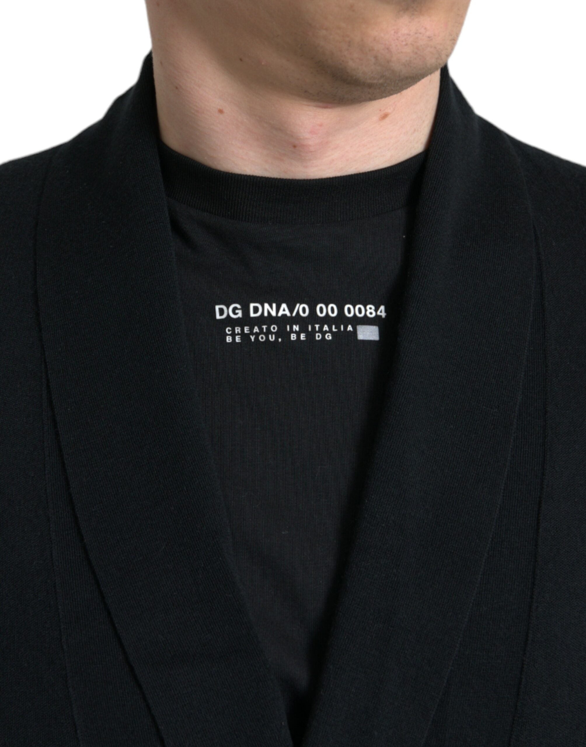 Black cashmere long sleeve belted wrap robe by Dolce & Gabbana shown on a model.