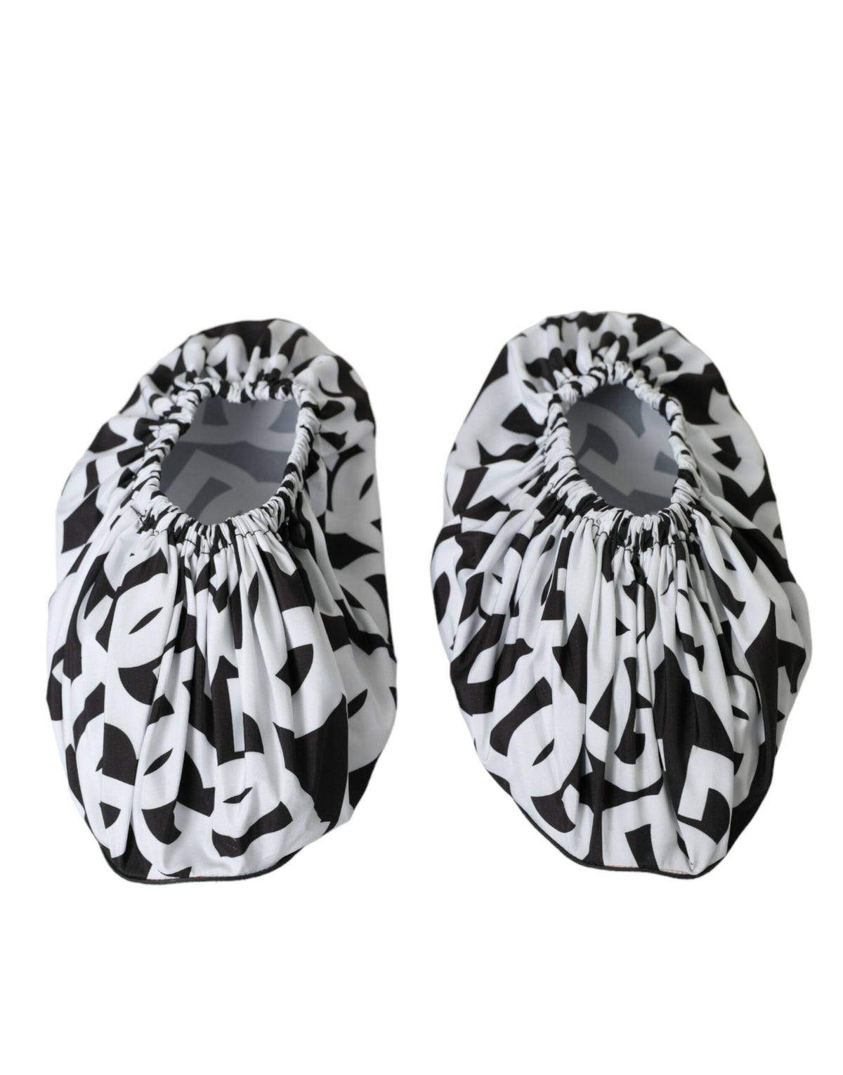 White nylon slip-on flats with Dolce & Gabbana logo print, featuring a sleek and minimalist design for casual elegance.
