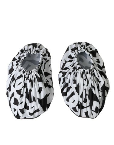 White nylon slip-on flats with Dolce & Gabbana logo print, featuring a sleek and minimalist design for casual elegance.