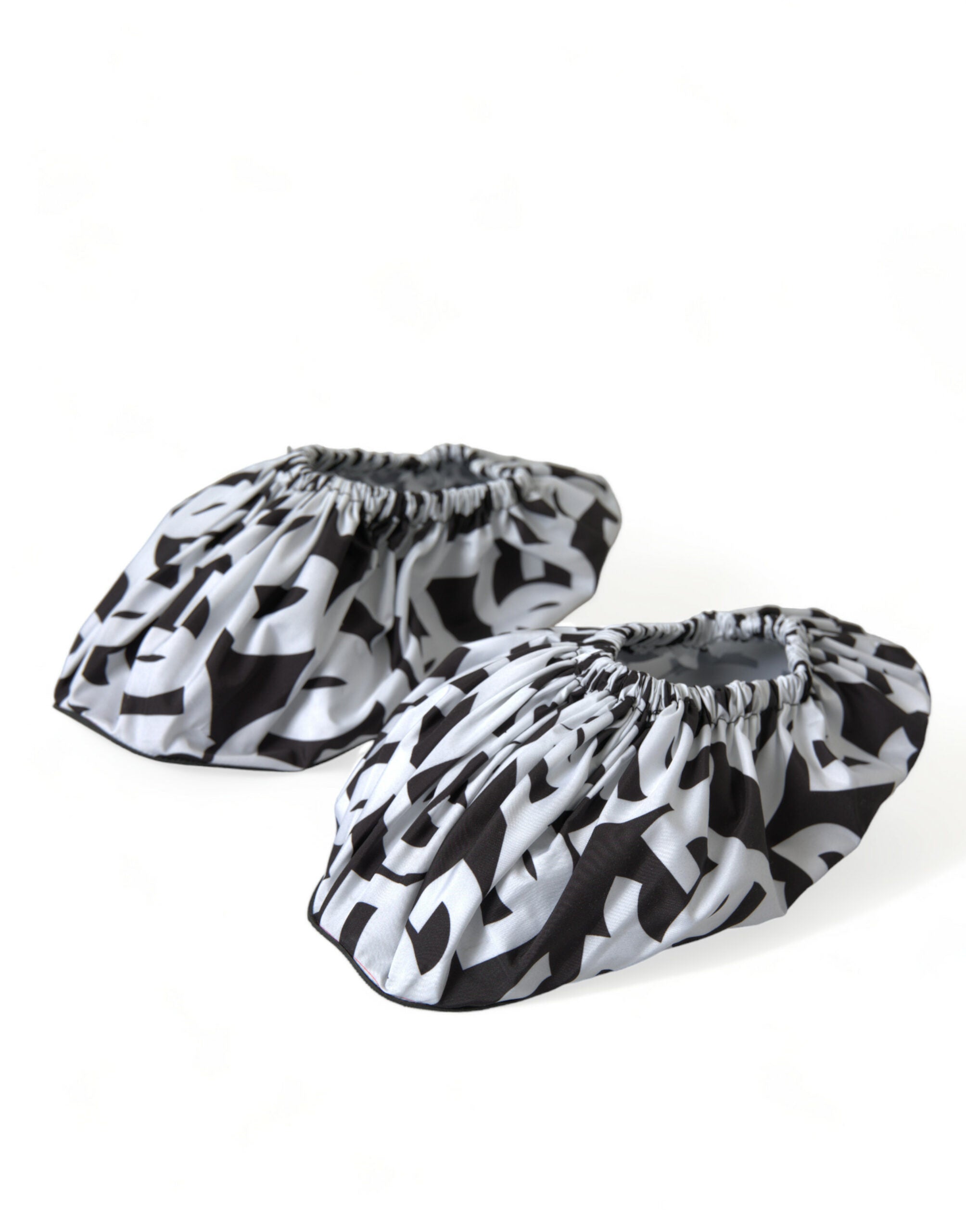 White nylon slip-on flats with Dolce & Gabbana logo print, lightweight and comfortable footwear for casual wear.