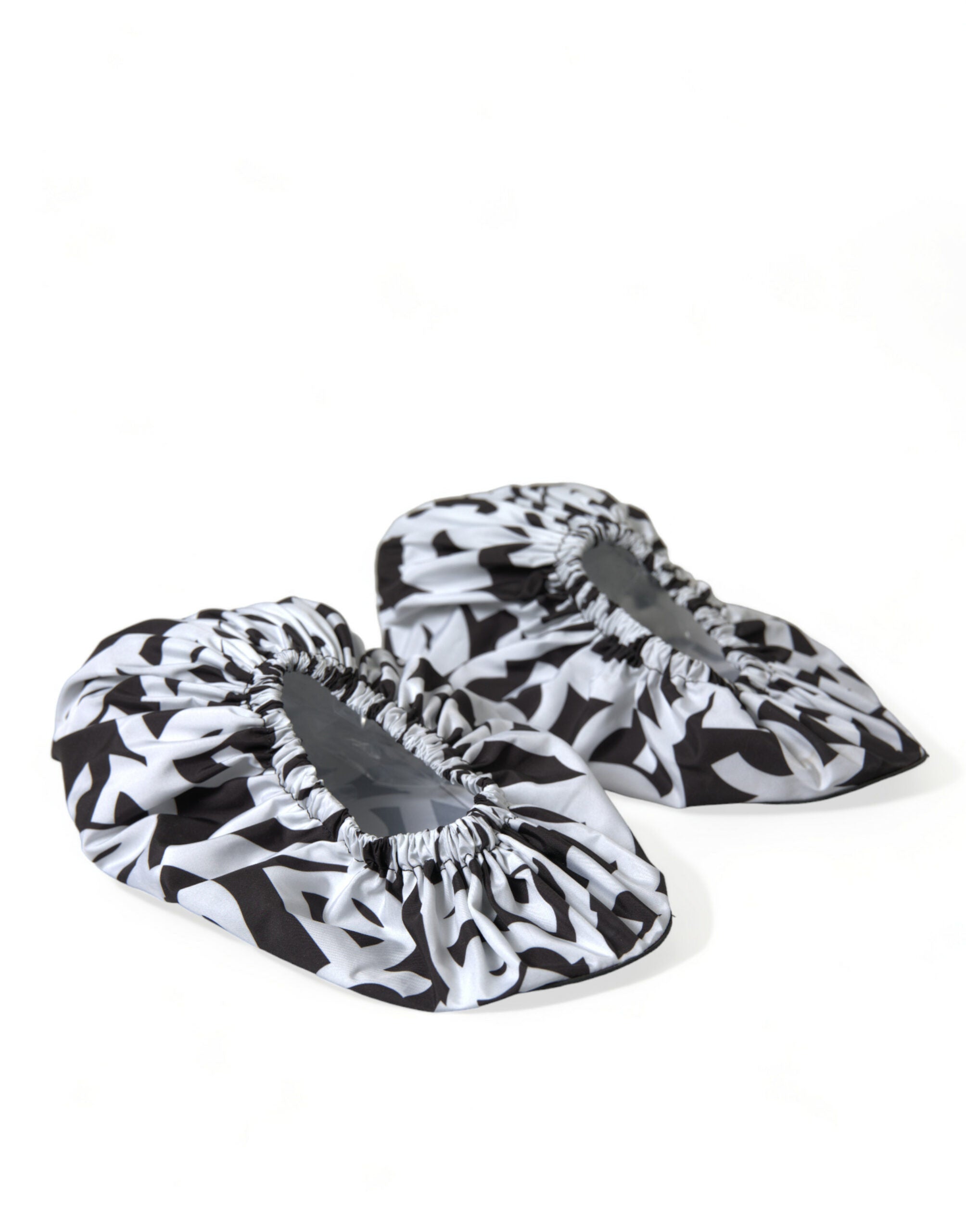 White nylon slip-on flats with Dolce & Gabbana logo print, stylish and comfortable women's shoes.