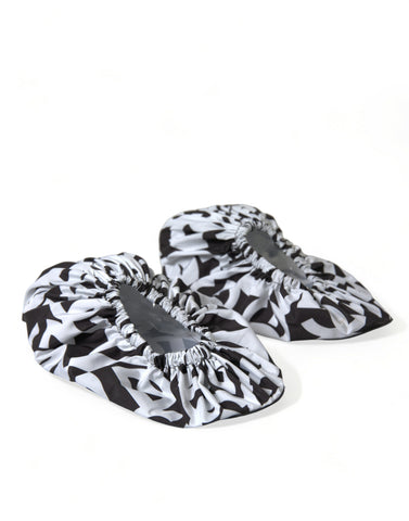 White nylon slip-on flats with Dolce & Gabbana logo print, stylish and comfortable women's shoes.