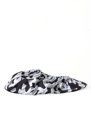 White nylon slip-on flats by Dolce & Gabbana with logo print, featuring a sleek and minimalist design.