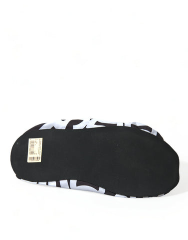White nylon slip-on flats with Dolce & Gabbana logo print, stylish and comfortable footwear for casual or chic outfits.