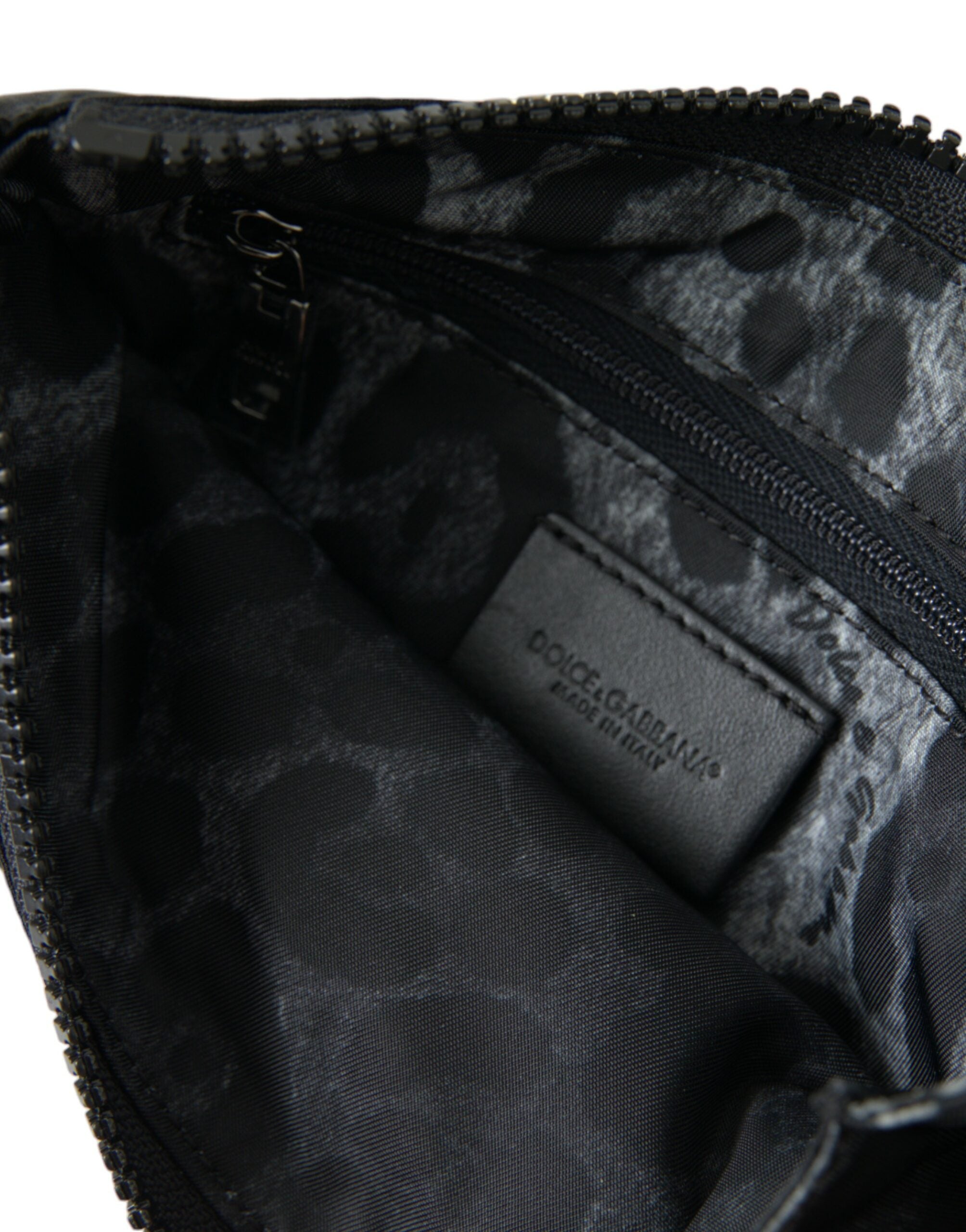 Black nylon Dolce & Gabbana logo plaque keyring pouch with clutch bag design and silver hardware.