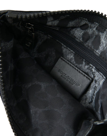 Black nylon Dolce & Gabbana logo plaque keyring pouch with clutch bag design and silver hardware.