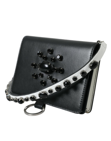 Black and white leather cardholder wallet with crystal embellishments by Dolce & Gabbana, featuring sleek design and compact size.