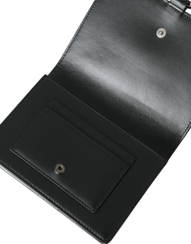 Dolce & Gabbana black and white leather cardholder wallet with crystal embellishments and sleek design.