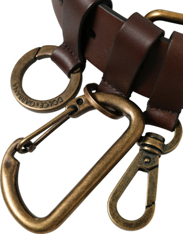 Brown calf leather belt with gold metal buckle by Dolce & Gabbana, showing the sleek strap and polished buckle detail.