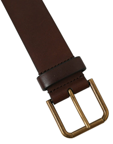 Brown calf leather belt with gold metal buckle, stylish Dolce & Gabbana accessory, featuring a sleek and sophisticated design.