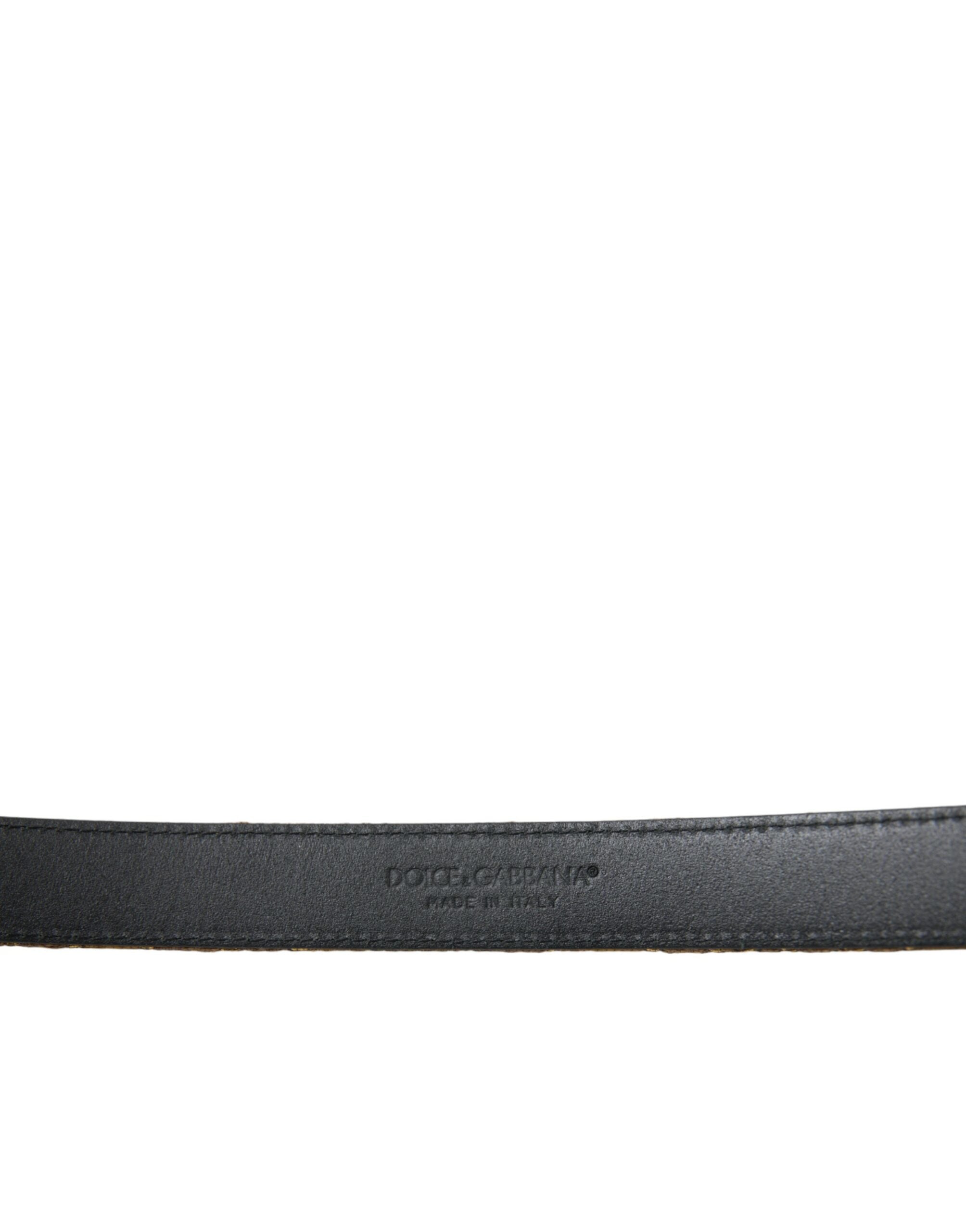 Gold leather Jacquard belt with silver metal buckle from Dolce & Gabbana, featuring intricate woven pattern and adjustable strap.