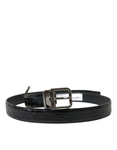 Black leather Dolce & Gabbana belt with silver metal buckle, featuring a stylish and adjustable design.