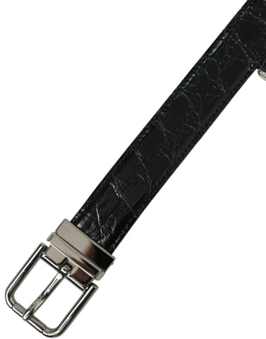 Black leather belt with silver metal buckle by Dolce & Gabbana, featuring a smooth finish and classic design.
