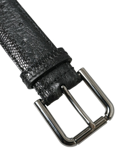 Black exotic leather belt with silver metal buckle by Dolce & Gabbana, showcasing textured leather and sleek metallic detail.